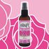 Waft Air Freshener Rose in a brown bottle with pink label on a pink floral background