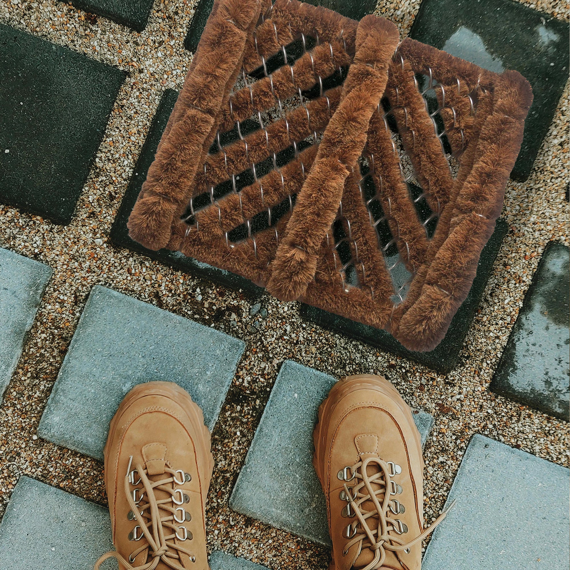 Loofco coir Boot Mat next to tan walking boots in a porch