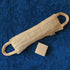 LoofCo back Scrubber made from loofah with a bar of saop on a blue towel