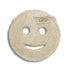 Round, beige loofah with a smiley face design on a white background
