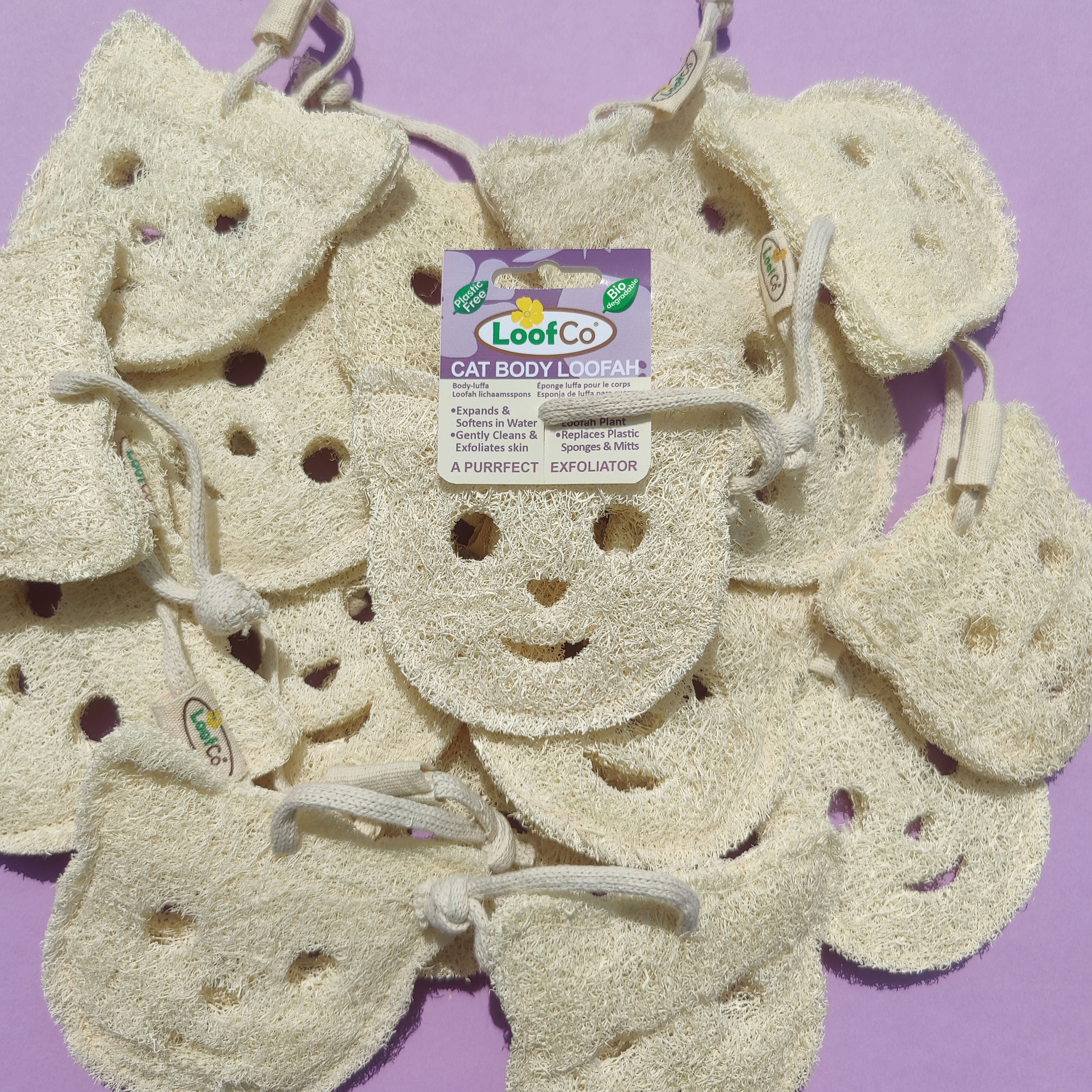 Cat body loofah with LoofCo branding on a purple background