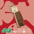 LoofCo Dust brush in packaging on a red and pink abstract background, featuring sustainability logos.