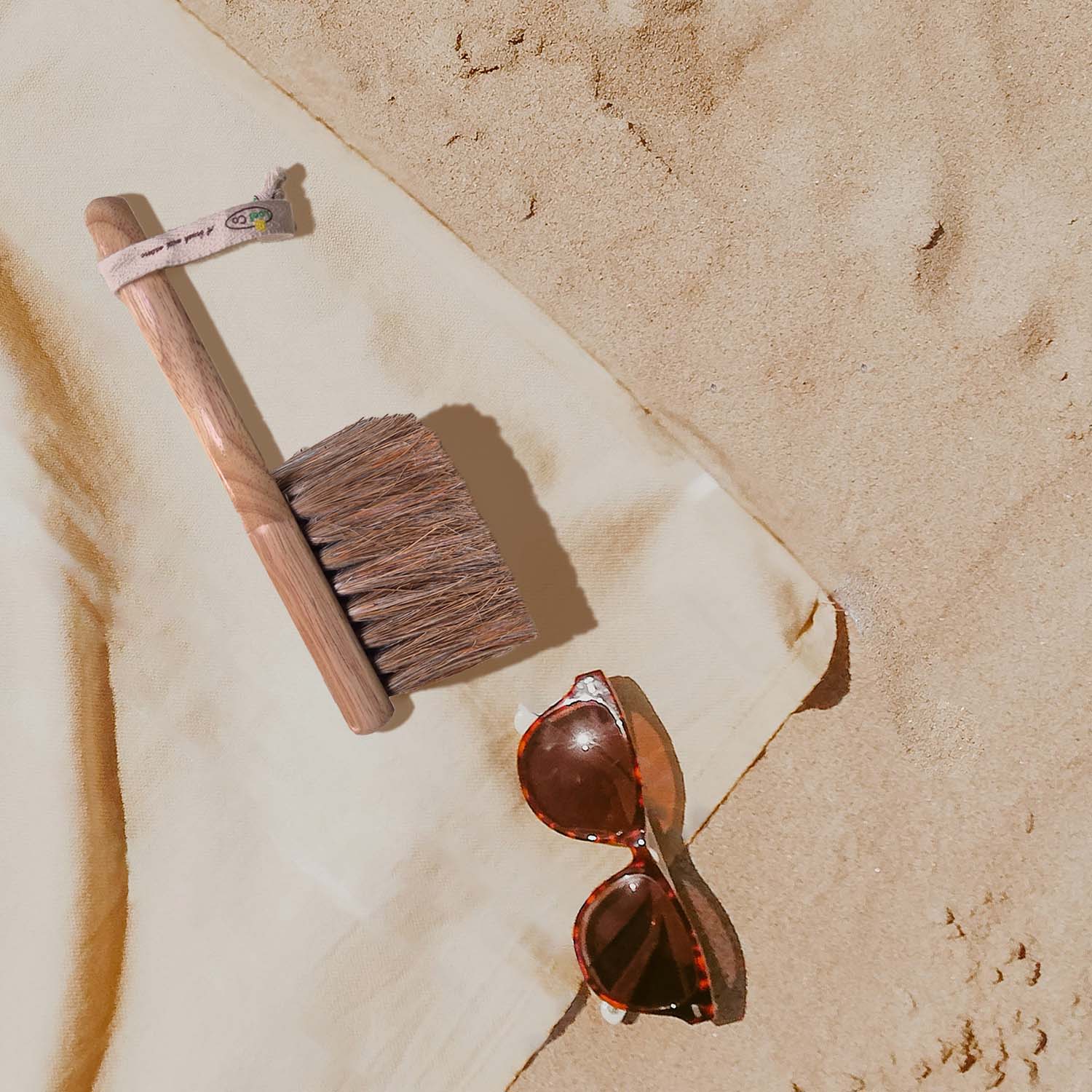 Beach Brush, a great product to help removing sand off your body and items.