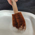 Brown coir LoofCo washing-Up  brush with wooden handle on a white ceramic bowl