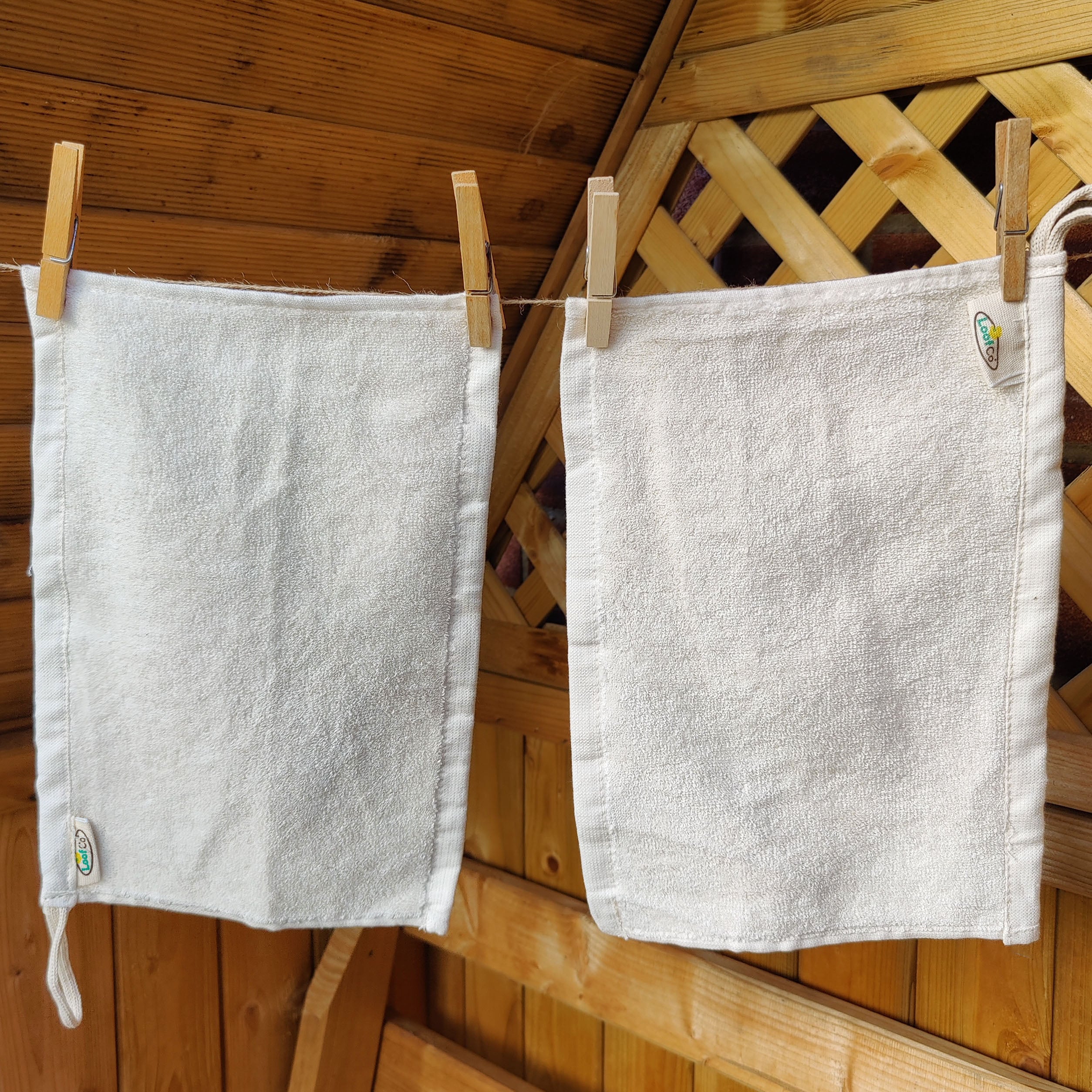 Image of 2 cotton LoofCo Kitchen Cloths hanging from washing line.