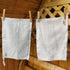 Image of 2 cotton LoofCo Kitchen Cloths hanging from washing line.